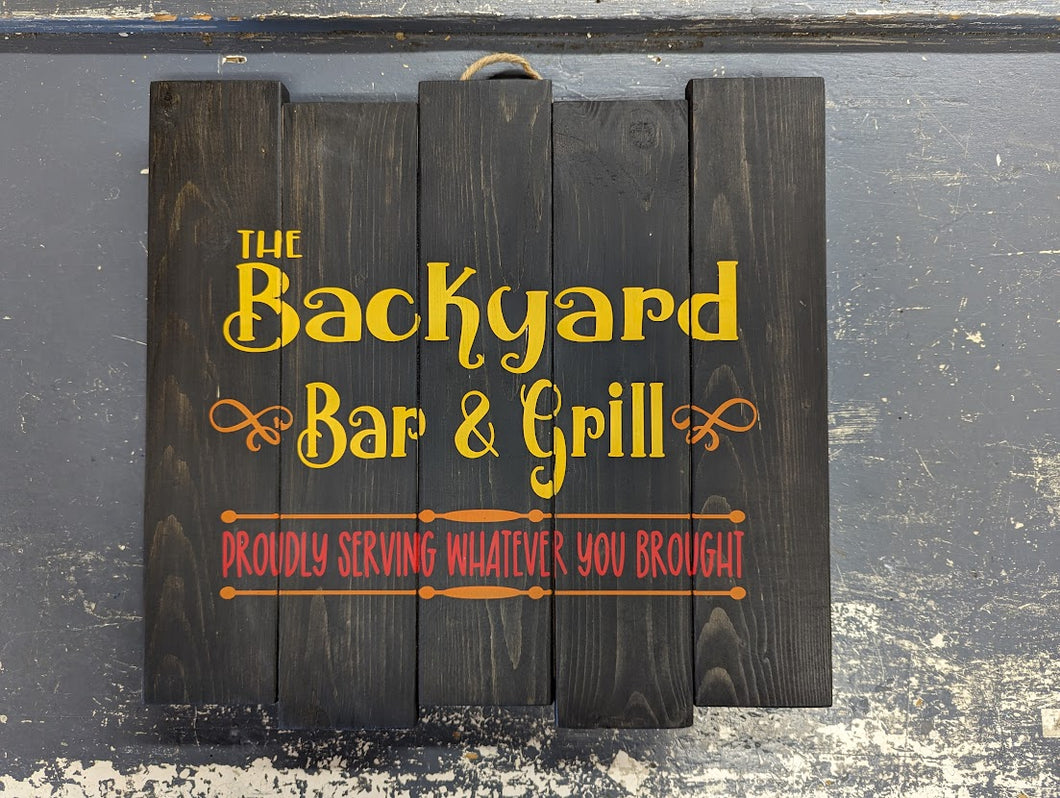 Pallet sign - The Backyard Bar & Grill, proudly serving whatever you brought